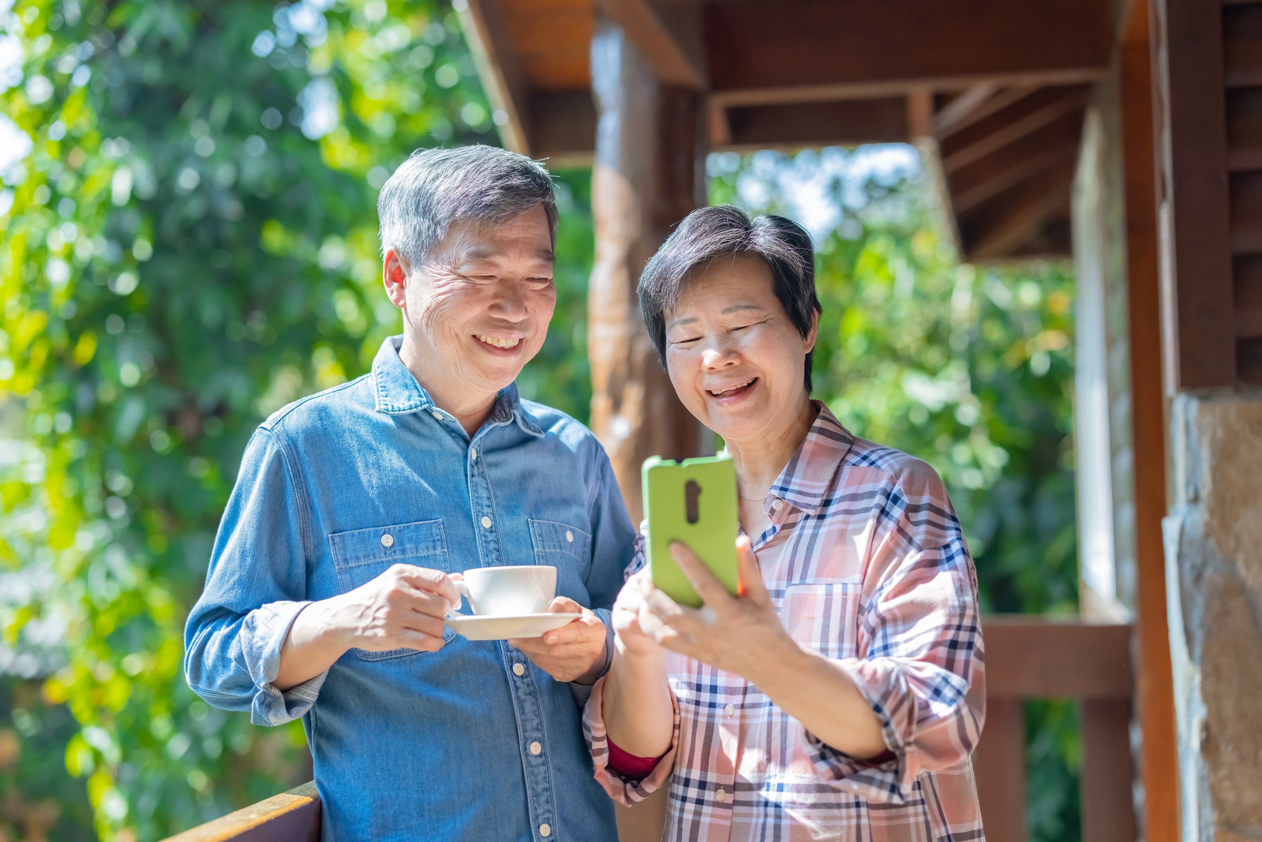 Retired Couple Watching Smartphone